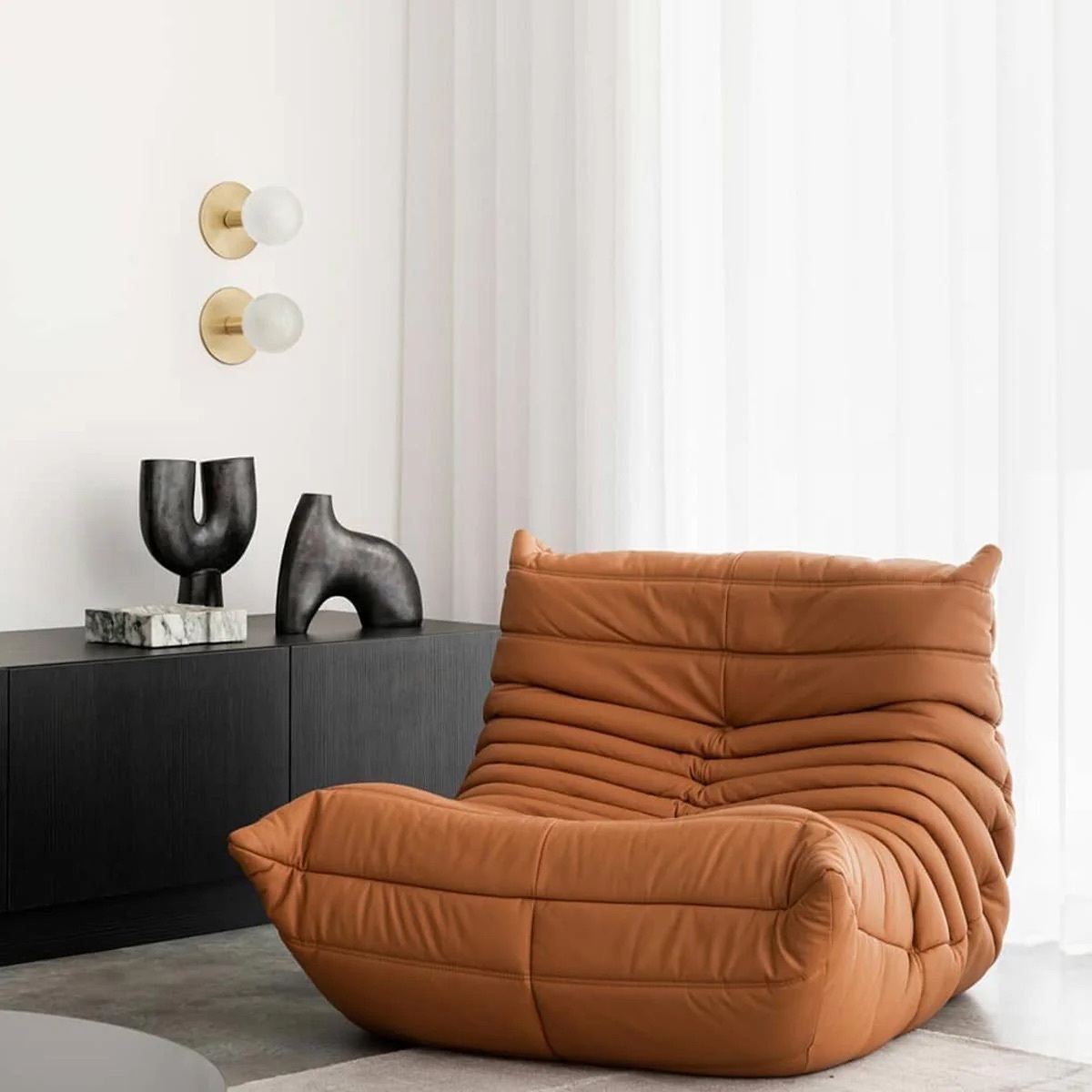 Togo armchair ligne roset gold ambientata 1500x1500